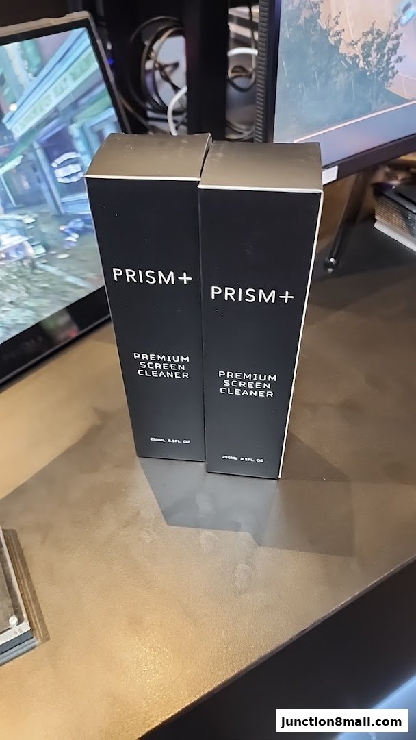 Two boxes of PRISM+ Premium Screen Cleaner are displayed on a counter.