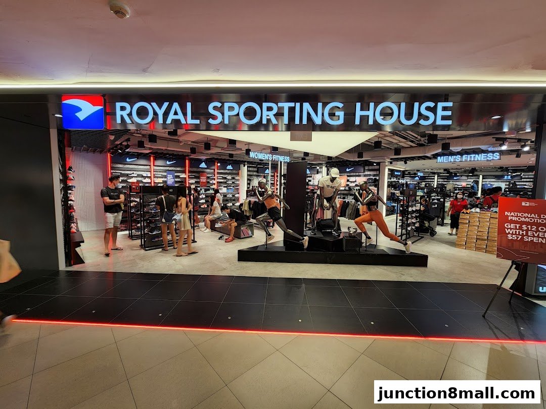 The entrance of Royal Sporting House, showcasing athletic apparel and footwear with mannequins.