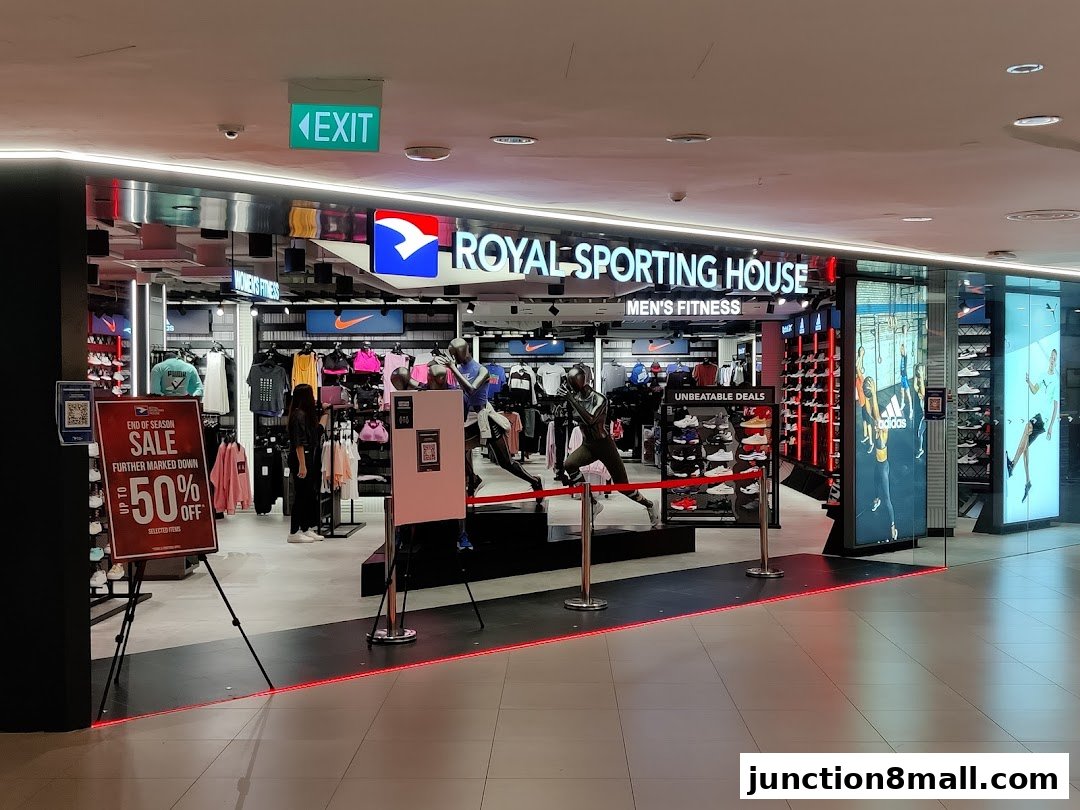 Royal Sporting House store entrance with sportswear, shoes, and sale signage.