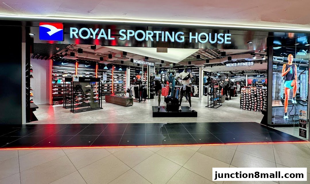 The entrance of Royal Sporting House, showcasing athletic apparel and footwear with mannequins.