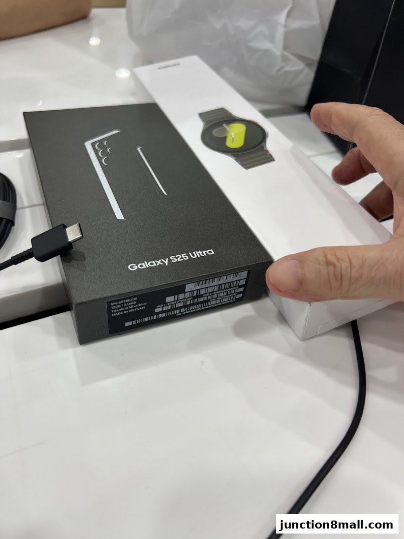 Samsung Galaxy S25 Ultra phone and smartwatch boxes are displayed on a white surface.