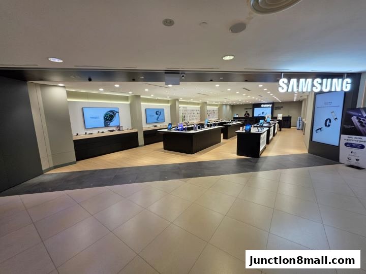 Interior of a modern Samsung Experience Store showcasing various electronic devices and displays.
