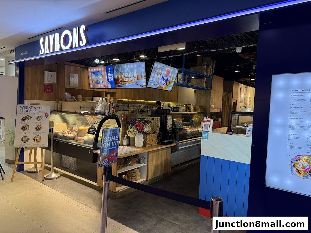 The Saybons shop front displays its name, menu screens, and a display case with food items.