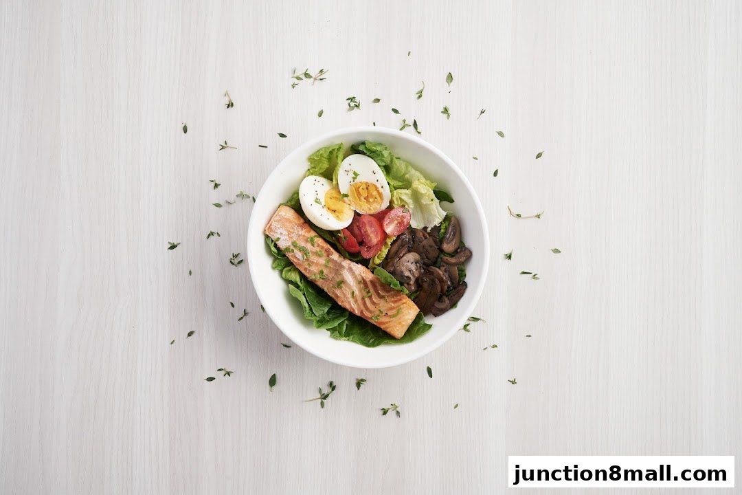 A healthy salmon salad with eggs, tomatoes, and mushrooms in a white bowl.