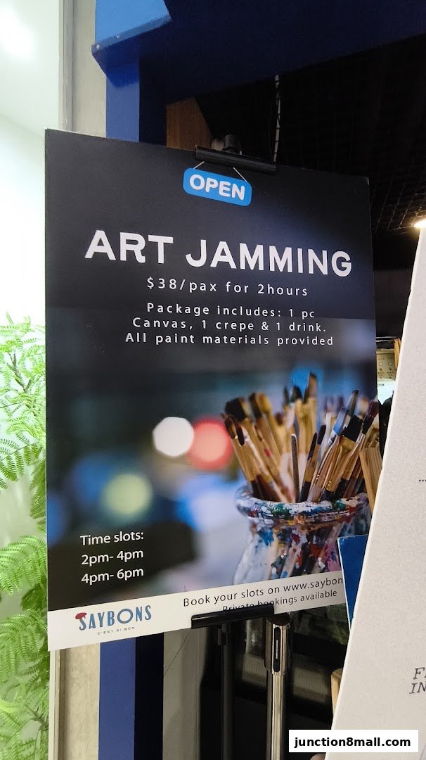 A sign advertises an 'Art Jamming' event with details on package, price, and time slots.