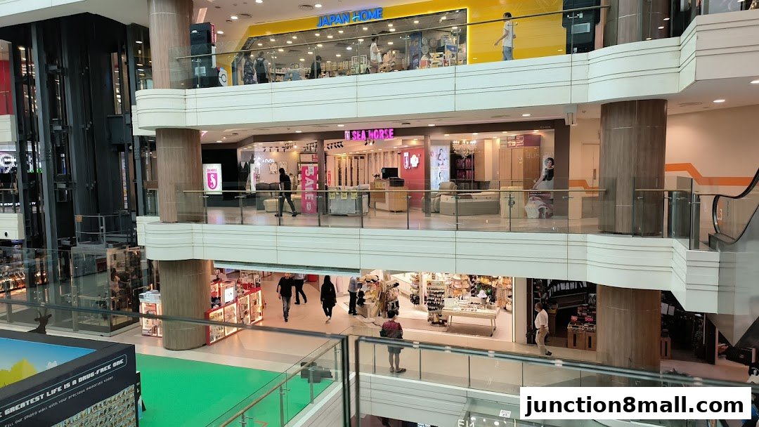 View of the Sea Horse shop and other stores on multiple levels of a shopping mall.
