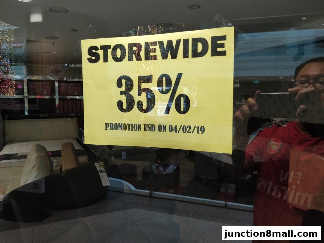 A yellow sign advertises a storewide 35% promotion ending on 04/02/19.