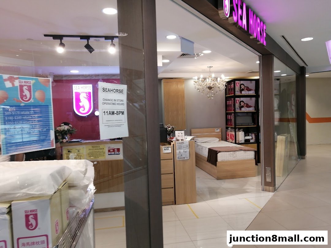 The Sea Horse store displays beds, mattresses, and promotional materials, with operating hours posted.