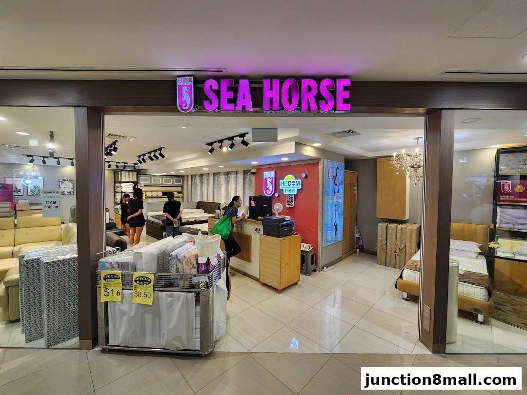 The Sea Horse Junction 8 shop displays mattresses and furniture, with staff assisting customers.