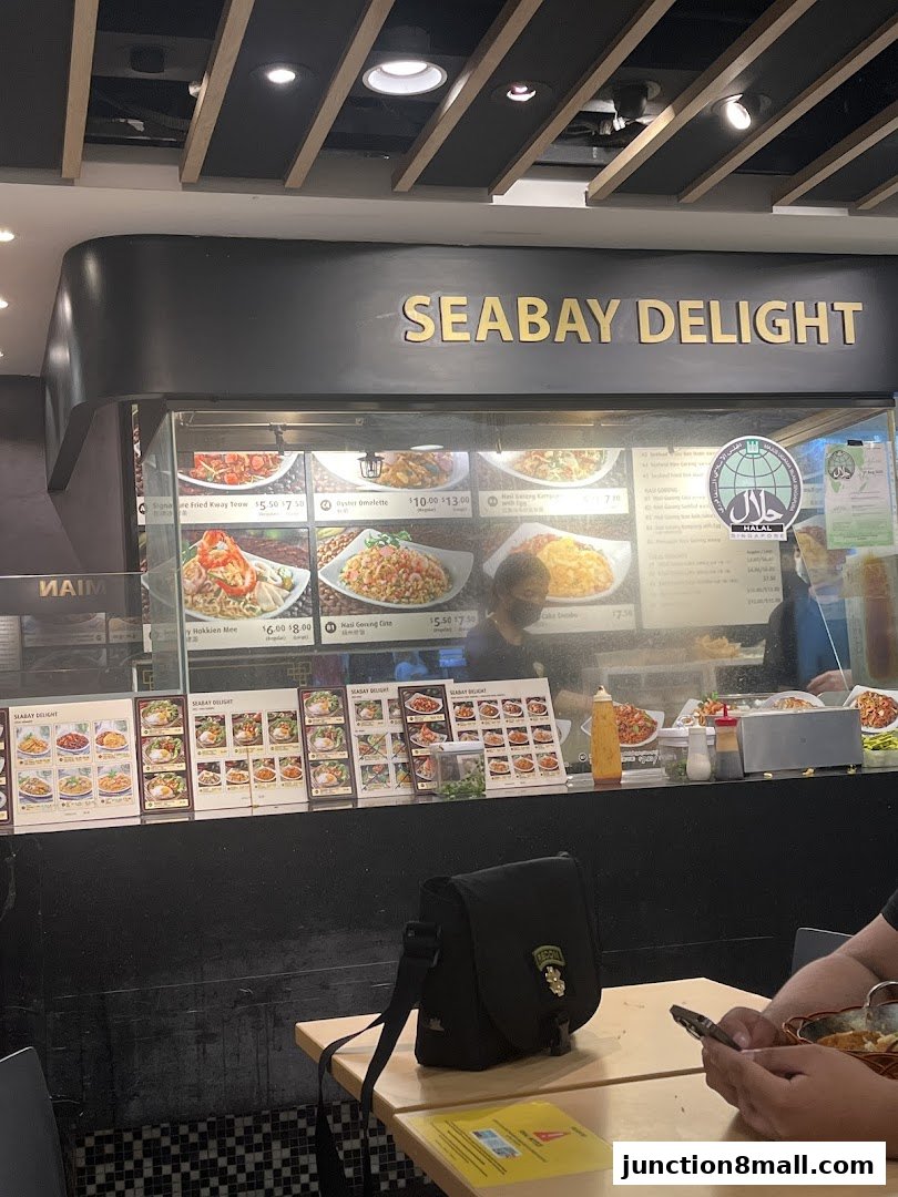 The Seabay Delight food stall with displayed menu items and a Halal certification.