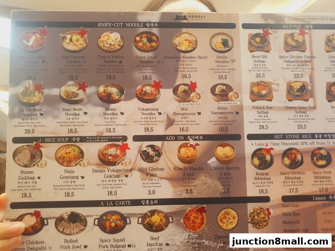 A menu from Seoul Noodle Shop featuring various Korean noodle dishes, rice pots, and side dishes.