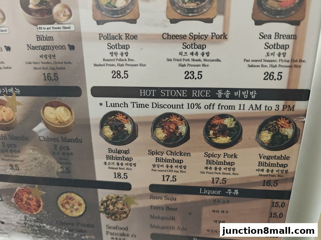 A menu displaying various Korean dishes including bibimbap, sotbap, mandu, and pancakes, with prices.