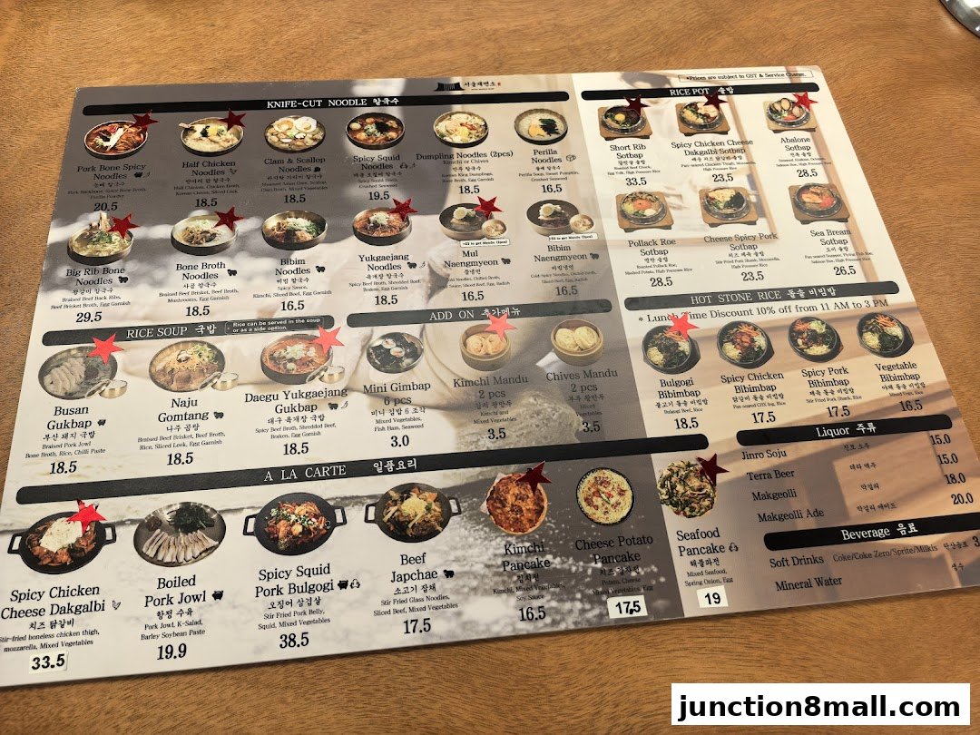 A menu from Seoul Noodle Shop featuring various Korean dishes like noodles, rice pots, and bibimbap.
