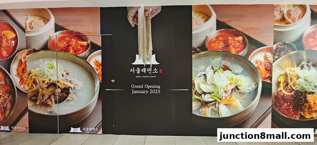 A large banner showcasing various Korean noodle dishes and announcing the grand opening of Seoul Noodle Shop.
