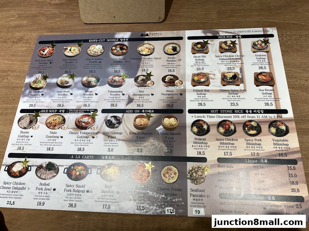 A menu from Seoul Noodle Shop featuring various Korean dishes like noodles, rice pots, and bibimbap.