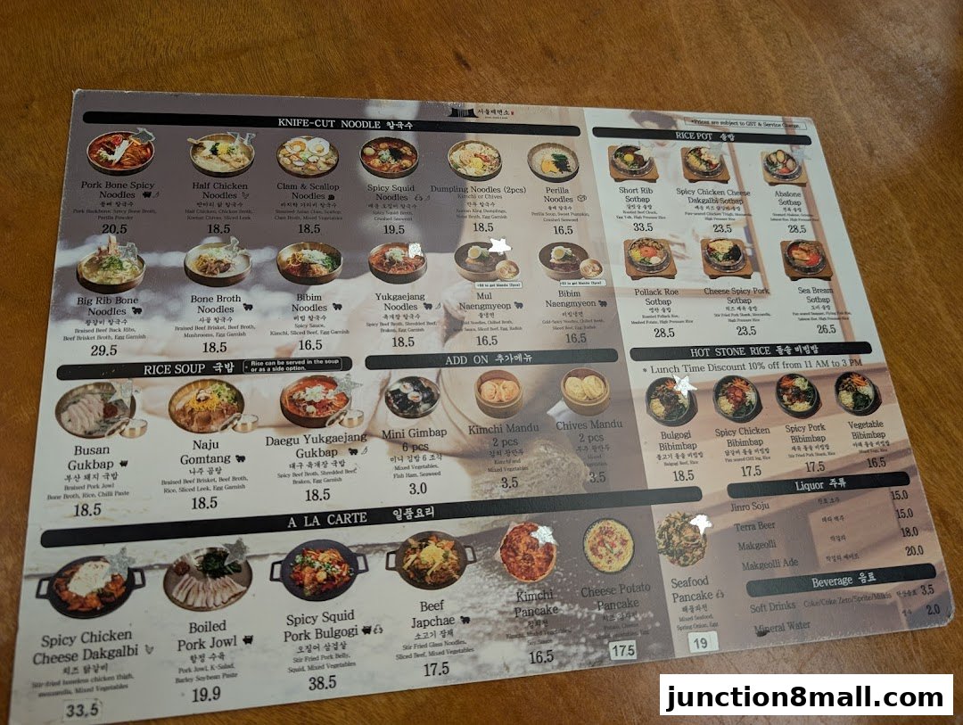 A menu from Seoul Noodle Shop featuring various Korean dishes like noodles, rice pots, and bibimbap.