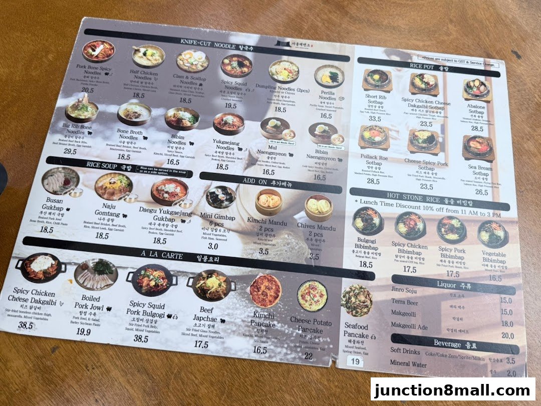 A menu from Seoul Noodle Shop featuring various Korean dishes like noodles, rice pots, and bibimbap.
