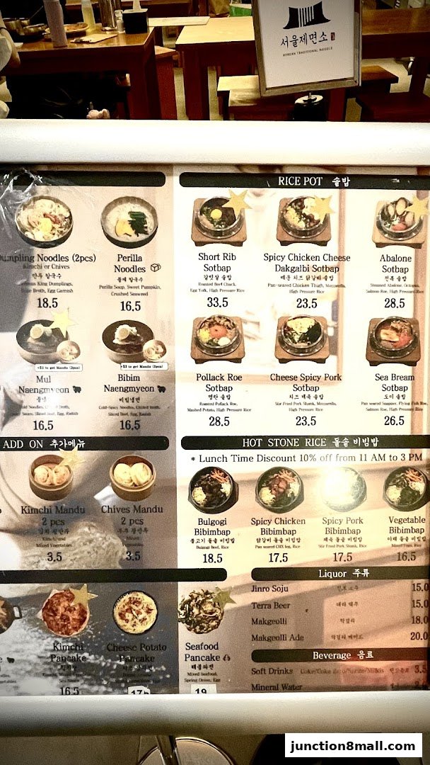 A menu board for Seoul Noodle Shop featuring various Korean dishes like noodles, rice pots, and pancakes.
