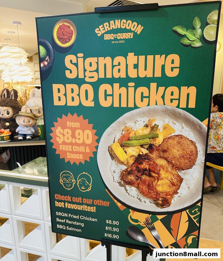A sign advertising Serangoon BBQ & Curry's Signature BBQ Chicken and other hot favorites.