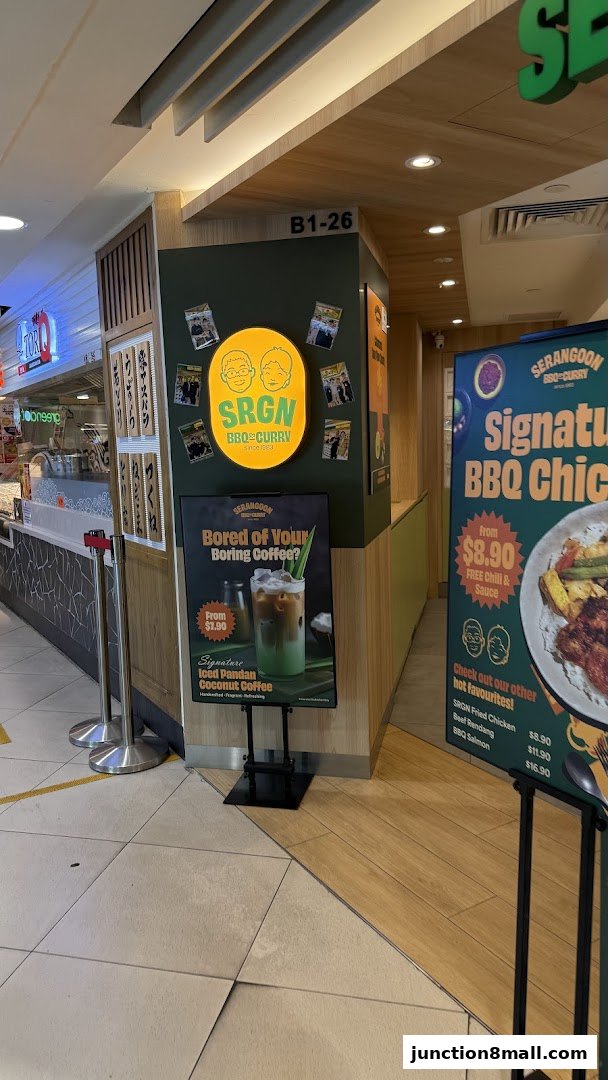 Shop front of Serangoon BBQ Curry Nasi Padang with promotional posters.