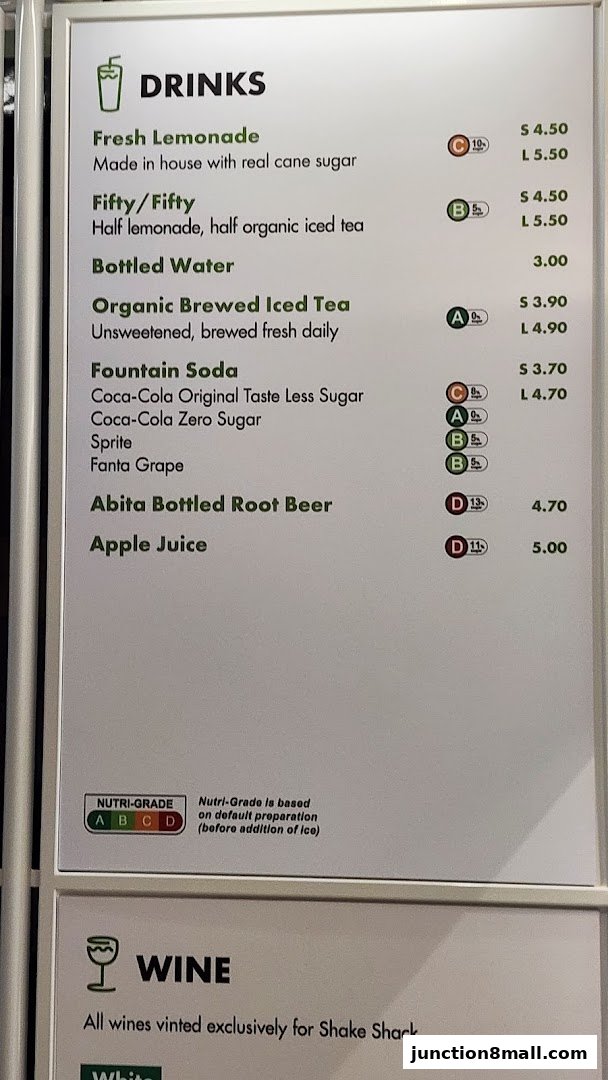 A menu board displaying drinks and wine options with prices and Nutri-Grade ratings.