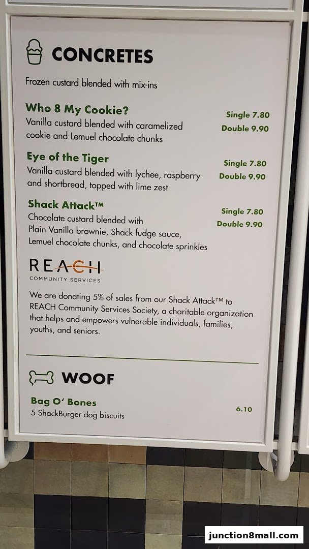 A menu board for Shake Shack featuring concretes and dog biscuits.