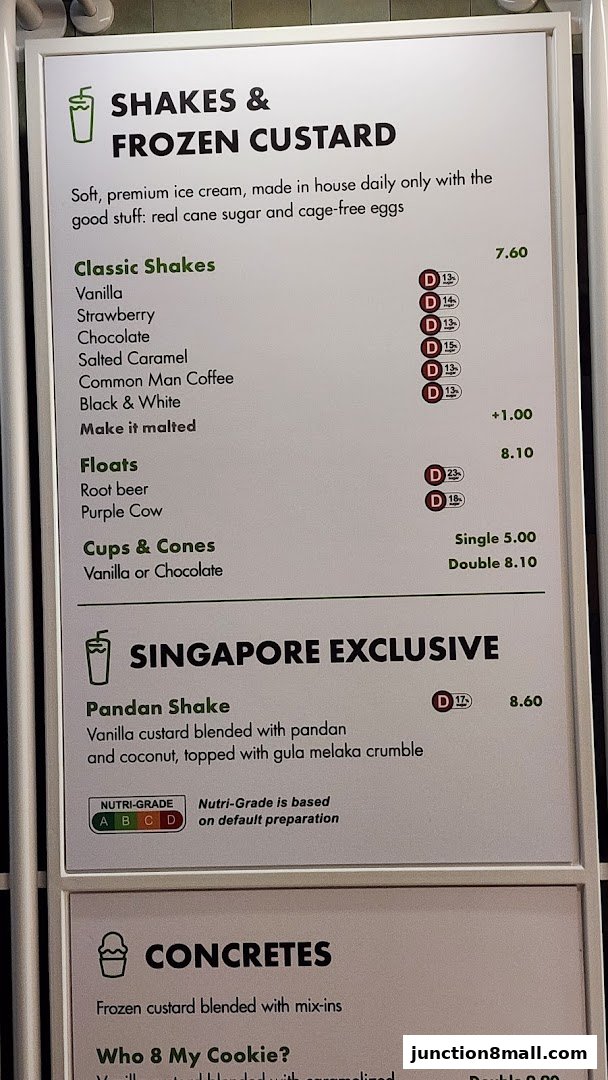 A menu board displaying shakes, frozen custard, and concretes with prices and descriptions.
