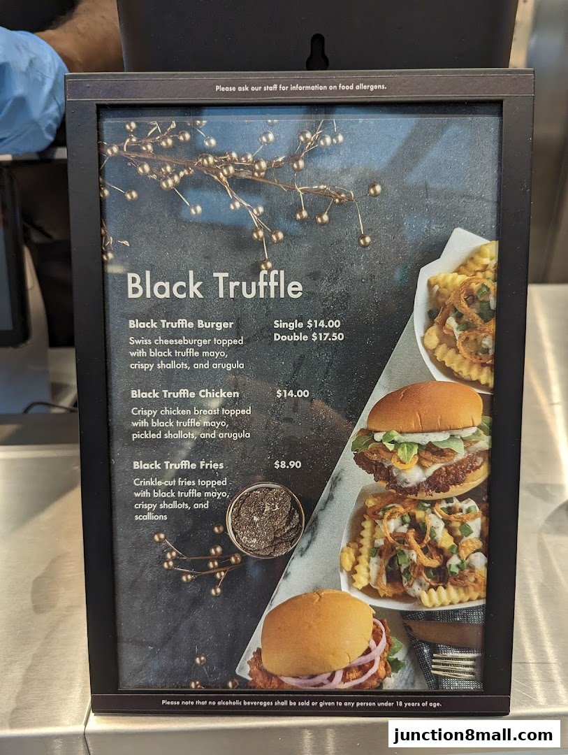 A menu board showcasing Shake Shack's Black Truffle items with enticing food photography.