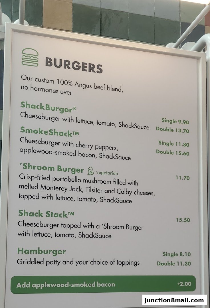 A menu board displaying various burger options and their prices at Shake Shack.