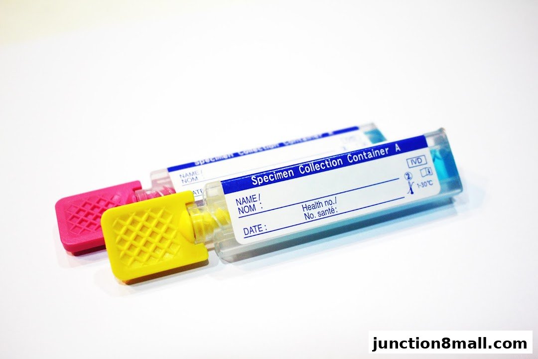 Two specimen collection containers with colorful caps on a white background.