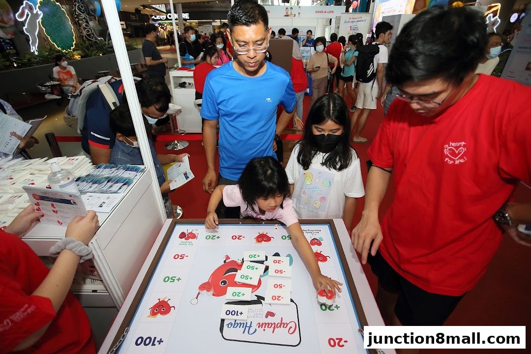 People playing a board game at a Singapore Heart Foundation event.