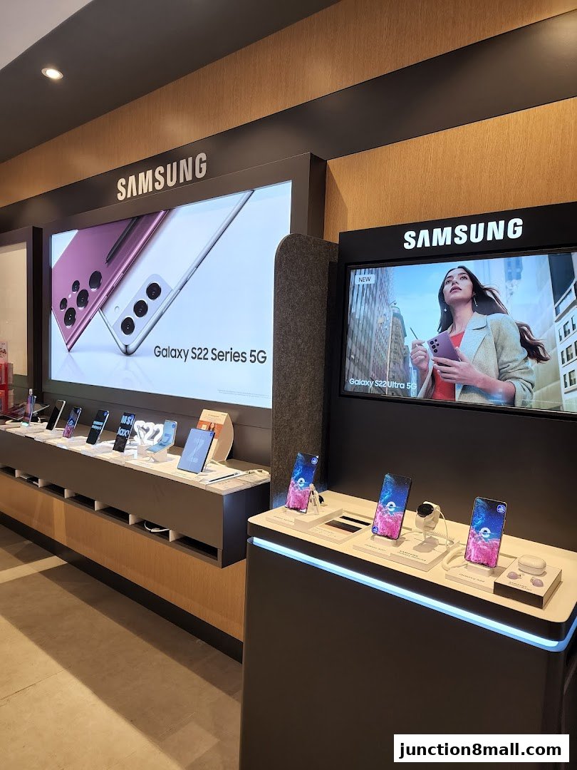 Samsung Galaxy S22 series phones and accessories displayed in a retail store.