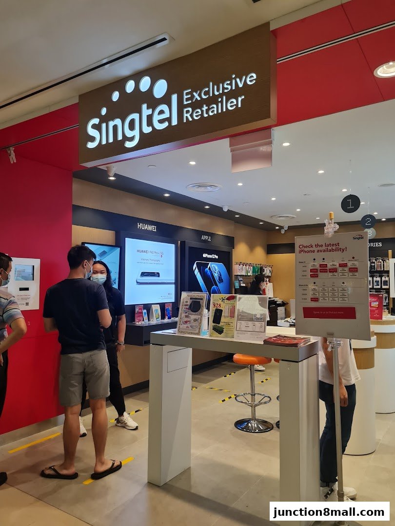 Interior view of a Singtel Exclusive Retailer shop with customers and product displays.