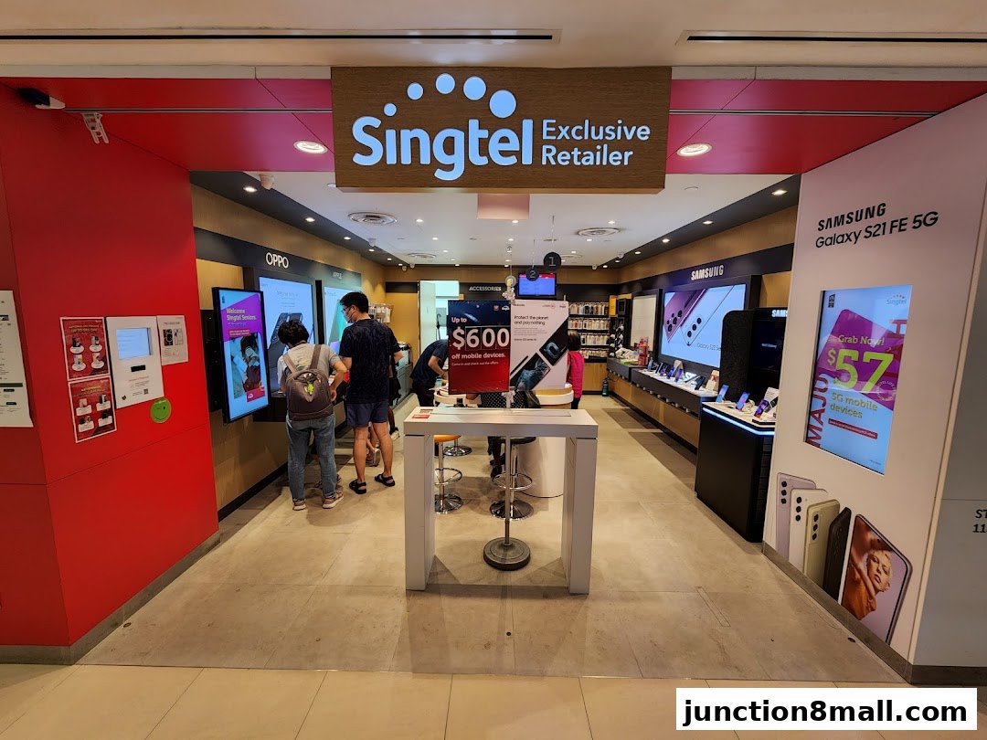 Interior view of a Singtel Exclusive Retailer shop showcasing mobile phones and accessories.