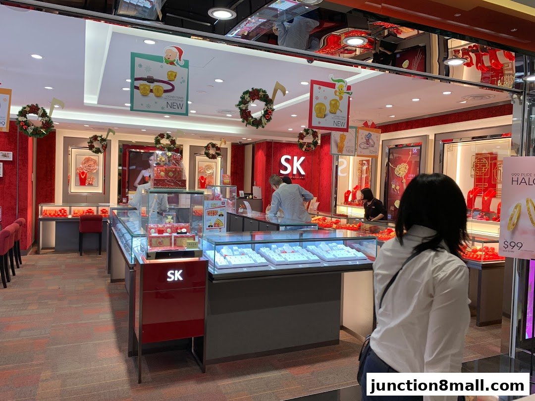 Interior view of SK Jewellery Junction 8, showcasing display cases filled with jewelry and festive decorations.