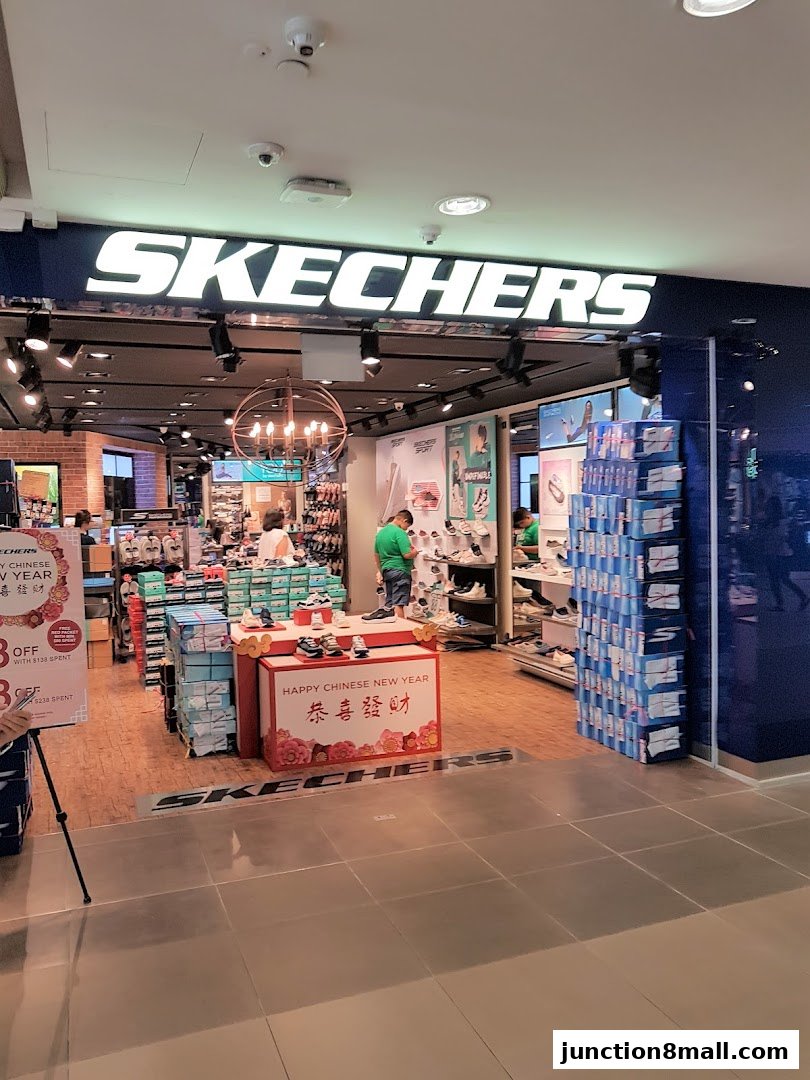 The Skechers store entrance displays shoes and a Happy Chinese New Year promotion.