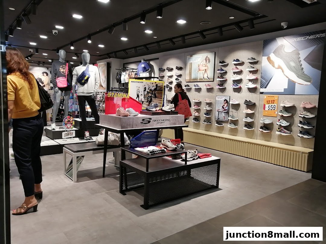 Interior view of a Skechers store showcasing various shoes on display and mannequins.