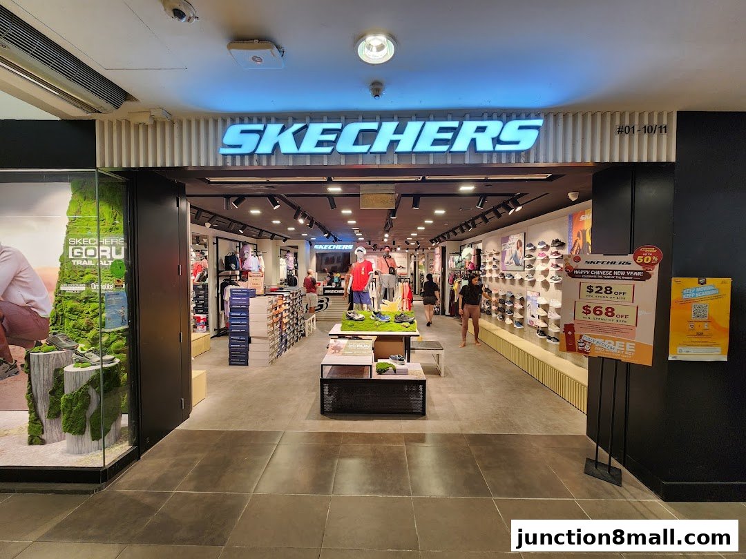 The entrance to a Skechers shoe store, showcasing footwear and apparel.