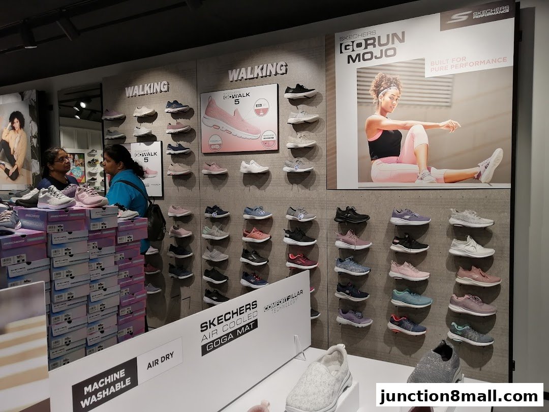 Skechers store interior showcasing various walking shoes and a promotional display.