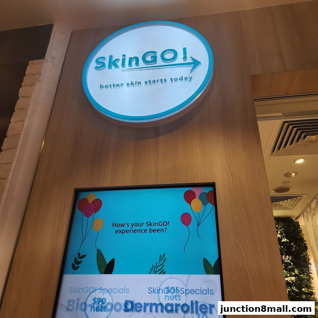 The SkinGO! shop sign and a digital display showing specials and asking about customer experience.