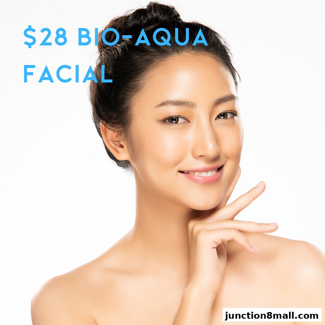 A woman with clear, glowing skin smiles, advertising a $28 Bio-Aqua Facial.