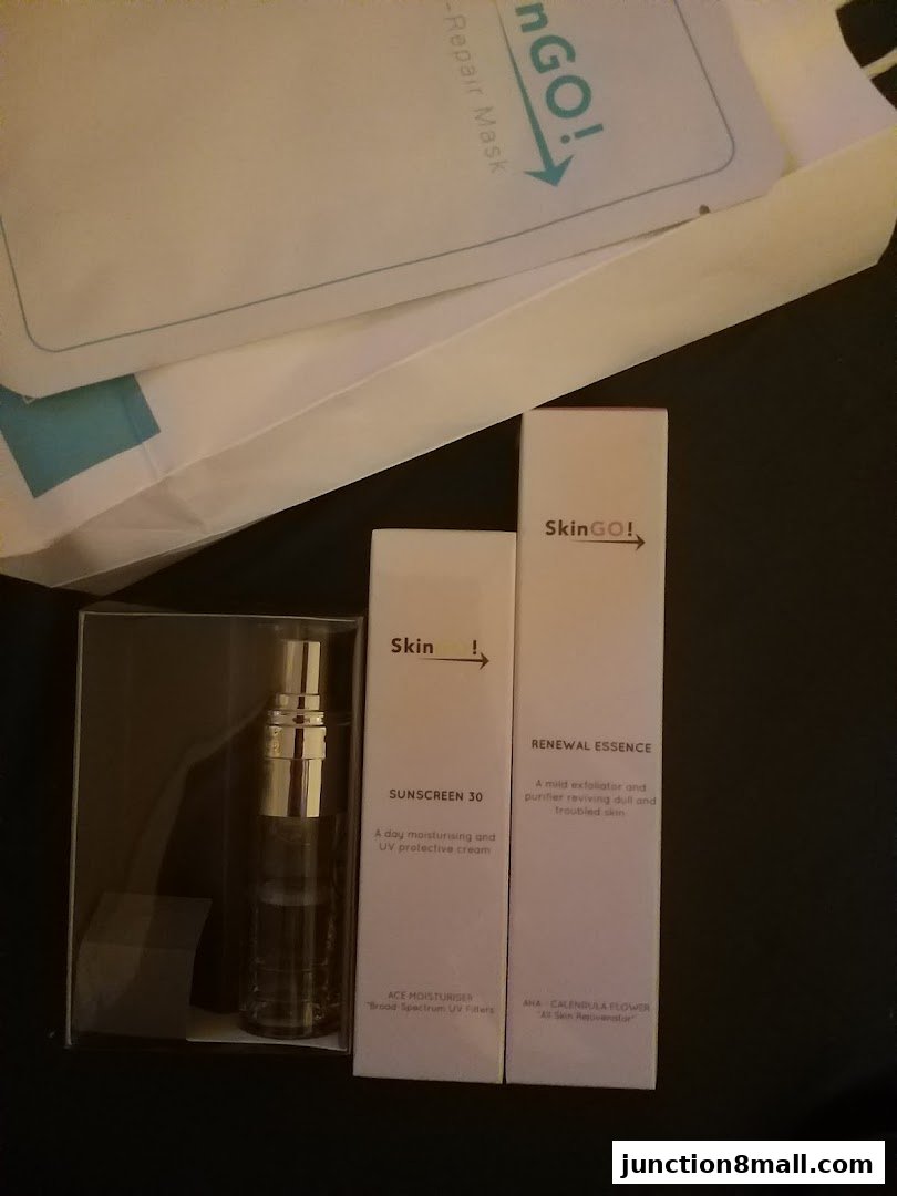 SkinGO! branded skincare products including sunscreen and renewal essence.