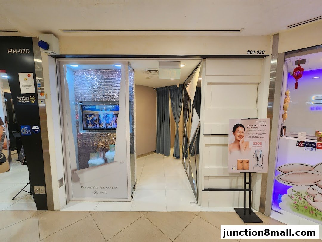 The entrance to SkinLab The Medical Spa, featuring a promotional poster and interior view.