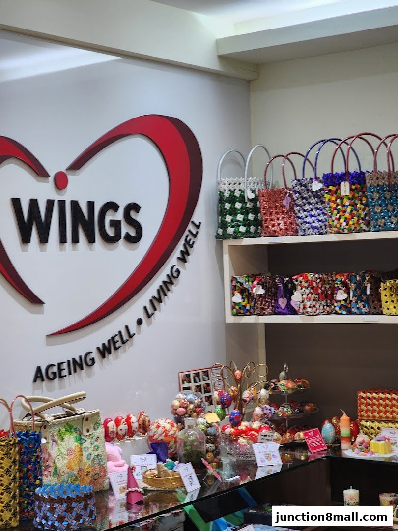 A shop interior displaying colorful woven bags, decorative eggs, and various gift items.