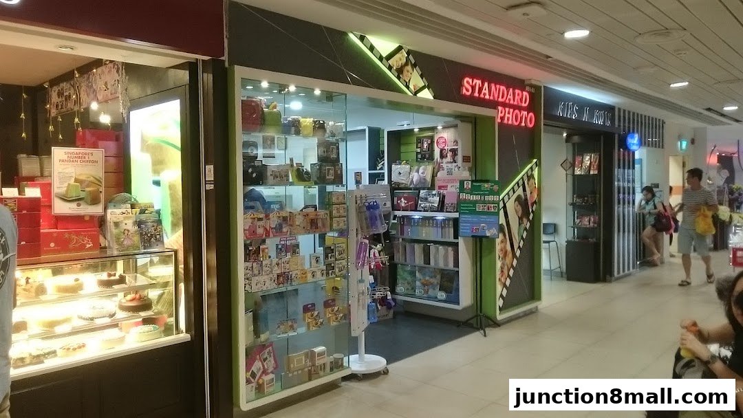 The Standard Photo shop front displays cameras, photo frames, and other photography-related items.