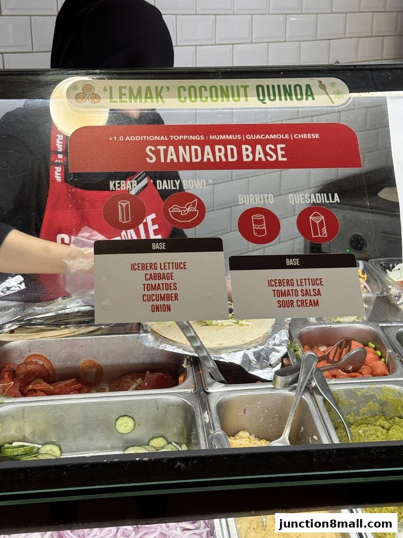 A display of fresh ingredients and menu options at a food establishment.