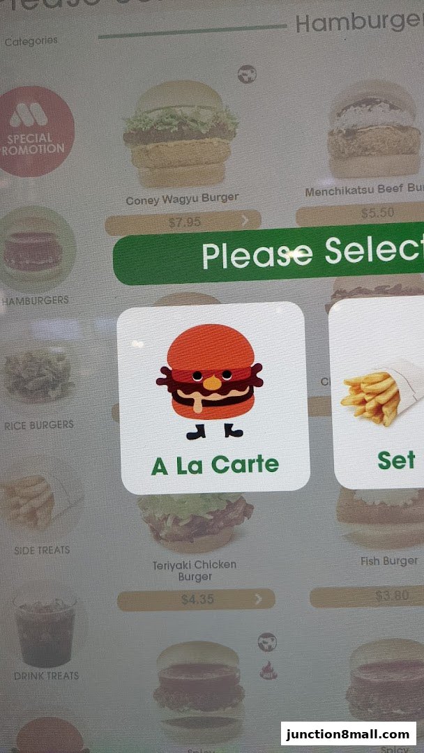 A digital menu displaying various burgers, sides, and drinks with prices.