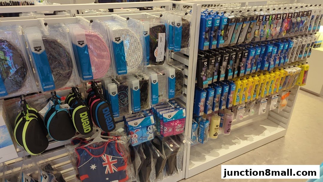 A well-organized display of swimming accessories, including caps, goggles, and training aids.