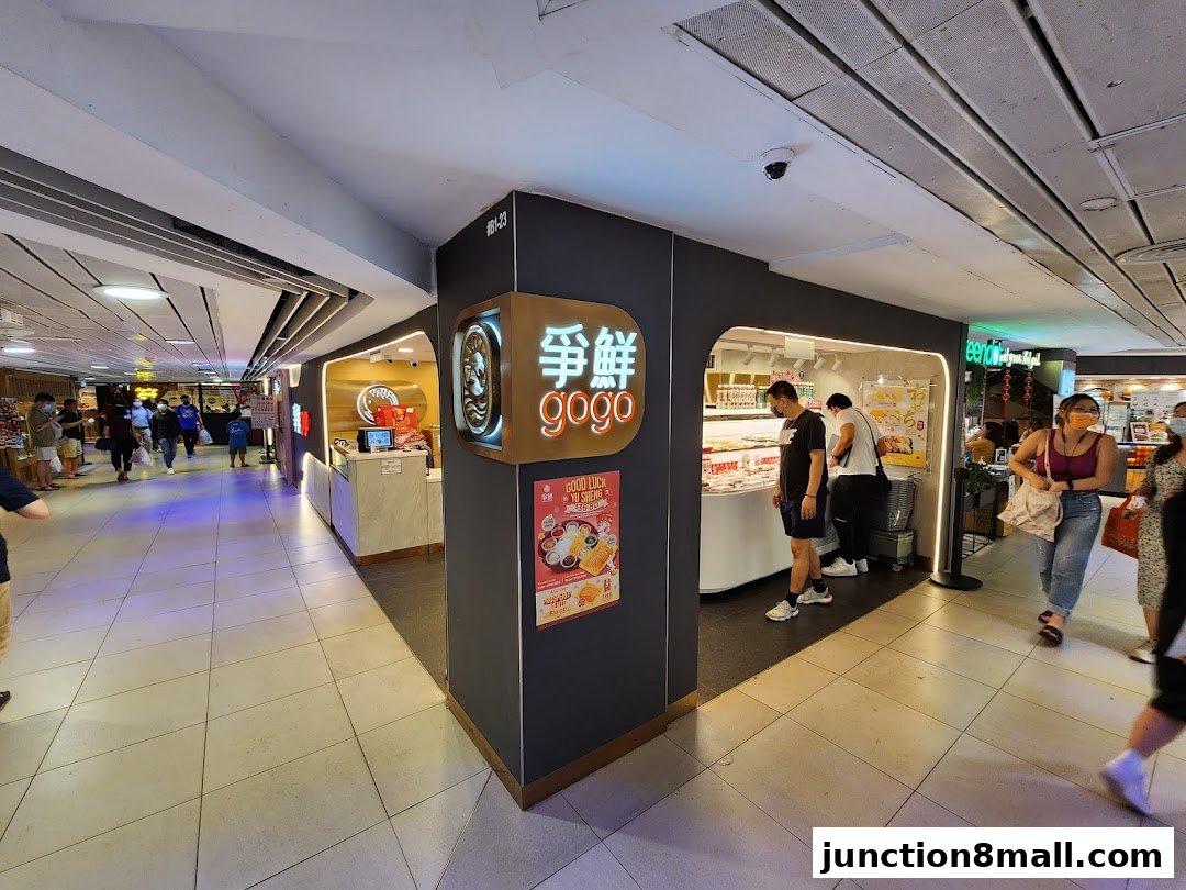 Sushi Gogo shop front with customers ordering and browsing.