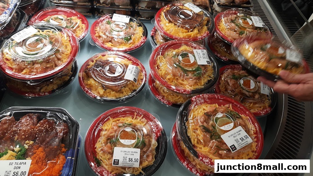 A selection of pre-packaged Japanese rice bowls with various toppings, ready for takeaway.